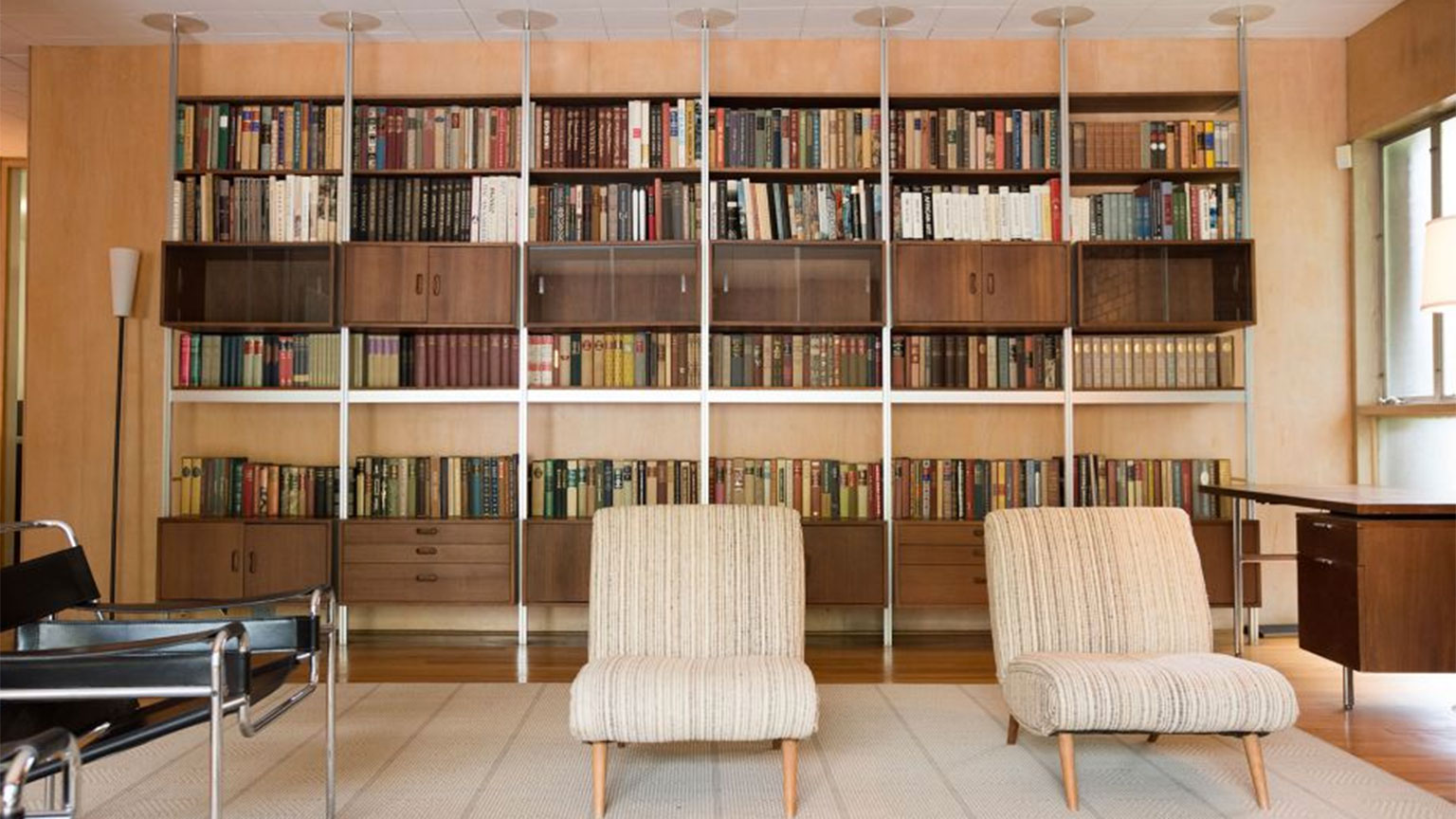 A photo of the custom-designed bookshelves in the living room of the Heffernan House on Georgia Tech campus.